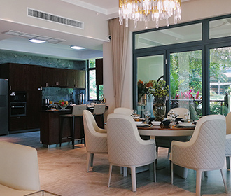 a dining room with a table and chairs