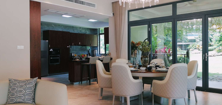 a dining room with a table and chairs